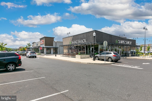 view of property featuring uncovered parking