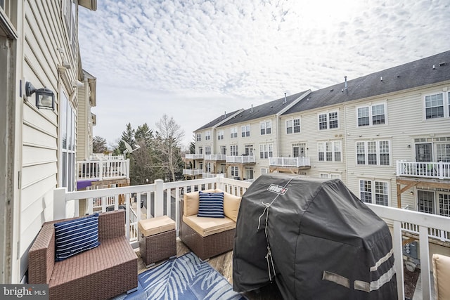 view of wooden balcony featuring a grill and a wooden deck