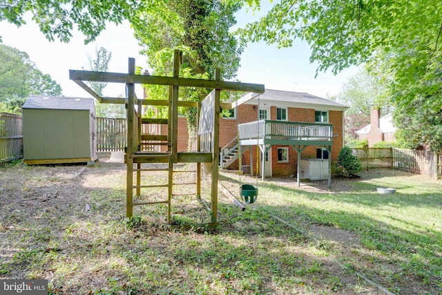 7424 Nancemond St, Springfield, VA 22150 - view of yard featuring a wooden deck, stairway, an outdoor structure, a shed, and a fenced backyard