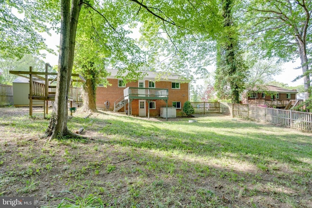 7424 Nancemond St, Springfield, VA 22150 - view of yard featuring a fenced backyard, a wooden deck, and stairway