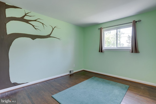 7424 Nancemond St, Springfield, VA 22150 - spare room with visible vents, baseboards, and wood finished floors