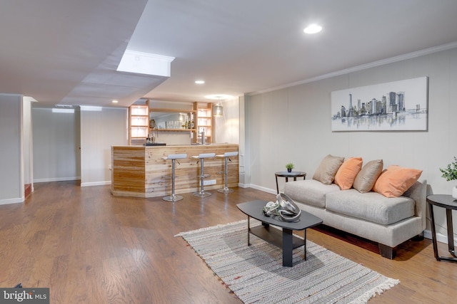 7424 Nancemond St, Springfield, VA 22150 - living room featuring ornamental molding, recessed lighting, baseboards, wood finished floors, and bar area