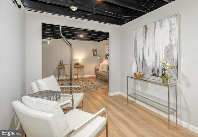 sitting room with wood finished floors and baseboards
