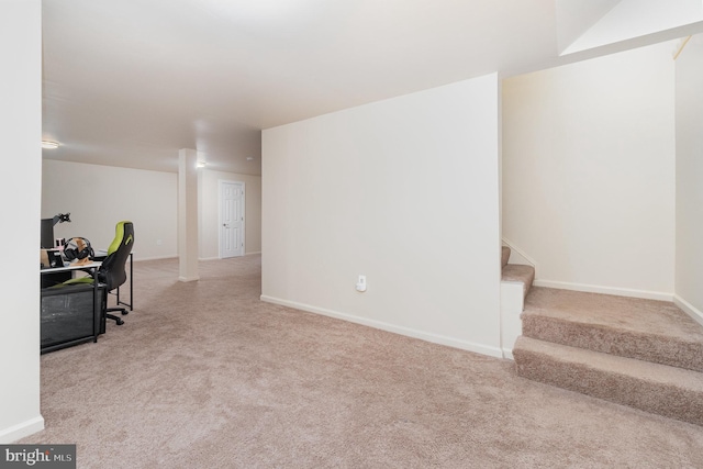 home office featuring light colored carpet and baseboards