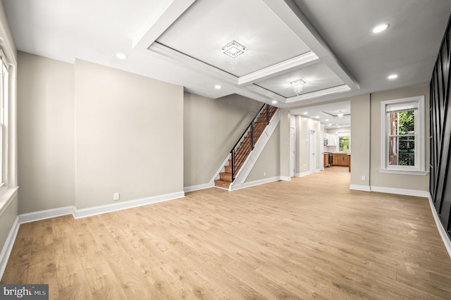 below grade area featuring stairway, recessed lighting, light wood-style flooring, and baseboards