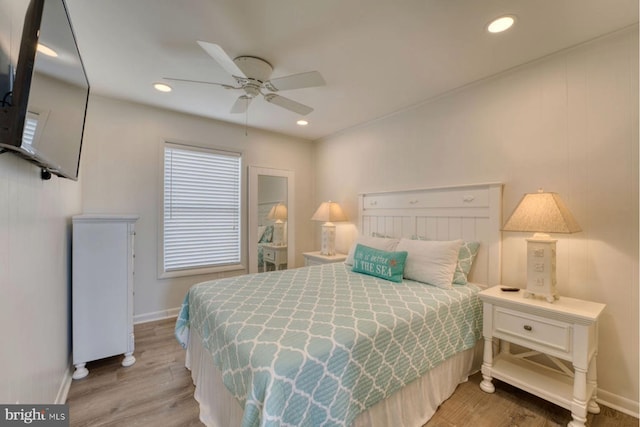 bedroom with baseboards, recessed lighting, a ceiling fan, and light wood-style floors