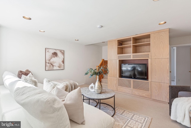 living room with recessed lighting and carpet