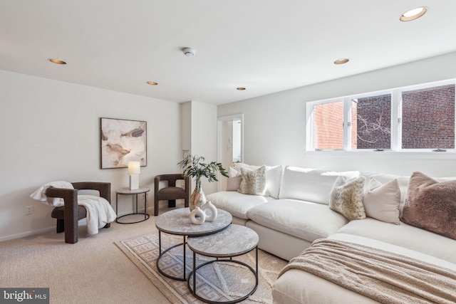 living area with recessed lighting, baseboards, and light carpet