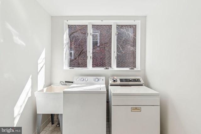 washroom with laundry area and washer and dryer