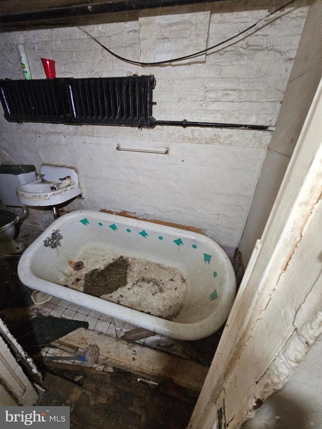 bathroom with a tub to relax in