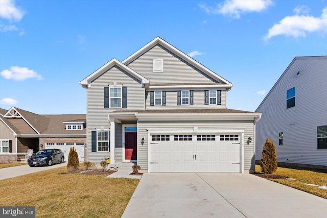 traditional-style home featuring entry steps, an attached garage, driveway, and a front lawn