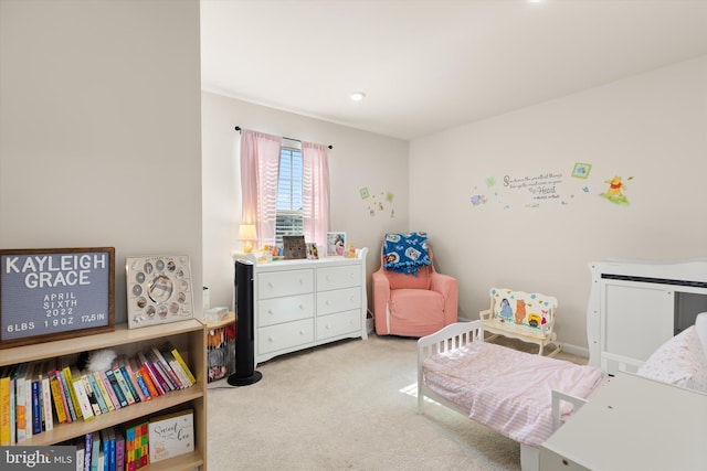 bedroom with light colored carpet