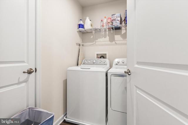 clothes washing area with laundry area and independent washer and dryer