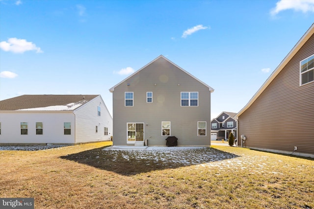 back of house featuring a residential view, a lawn, and a patio