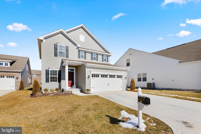 traditional-style house with a garage, a front yard, cooling unit, and driveway