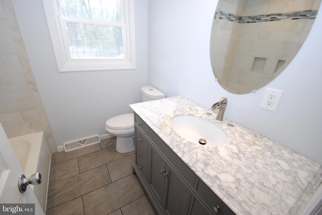 307 Broad St, Hainesport, NJ 08036 - full bath featuring visible vents, baseboards, toilet, vanity, and tile patterned flooring