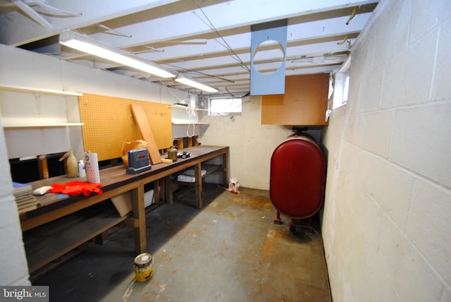 307 Broad St, Hainesport, NJ 08036 - below grade area featuring heating fuel, concrete block wall, and a workshop area