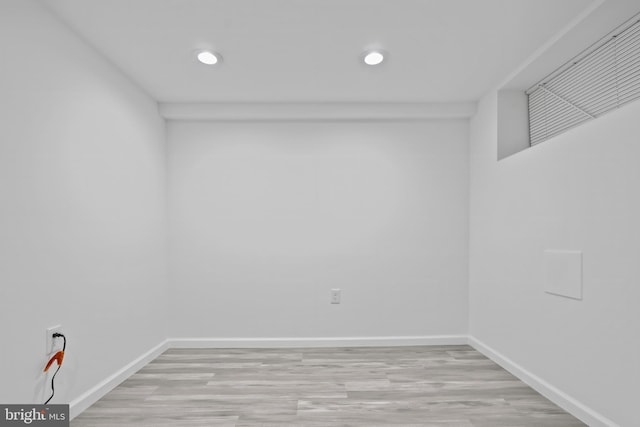 interior space featuring light wood finished floors, baseboards, and recessed lighting