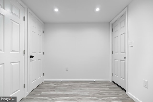 interior space featuring light wood-style floors, recessed lighting, and baseboards