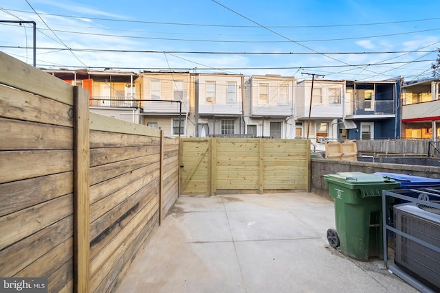 exterior space featuring a residential view and fence