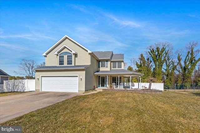 traditional home with covered porch, a front yard, fence, a garage, and driveway