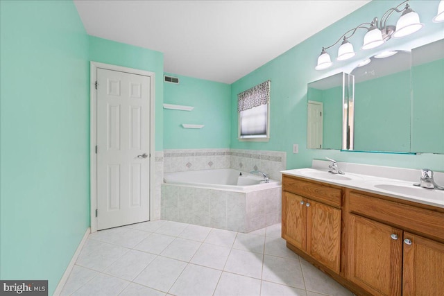 full bathroom featuring a garden tub, a sink, visible vents, tile patterned floors, and double vanity