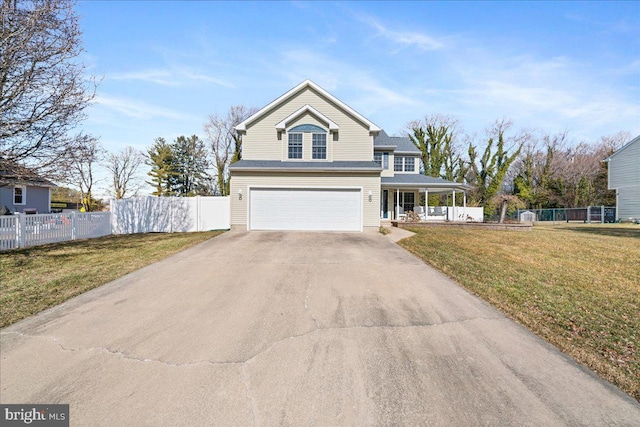 view of front facade with driveway, a porch, an attached garage, fence, and a front lawn