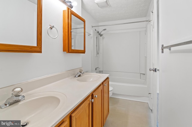 full bathroom with double vanity, a textured ceiling, a sink, and shower / bathing tub combination