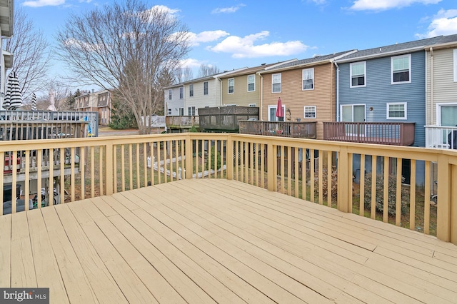 wooden deck with a residential view