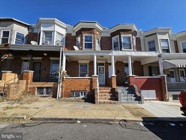 view of property featuring brick siding