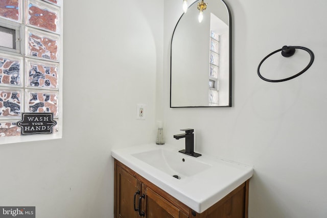 bathroom with a wealth of natural light and vanity