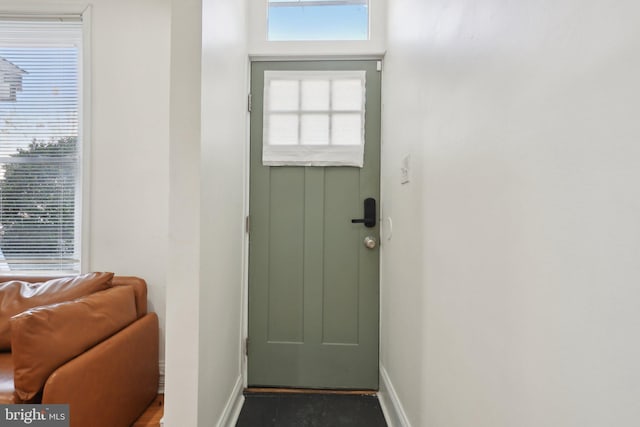 entryway with a healthy amount of sunlight and baseboards