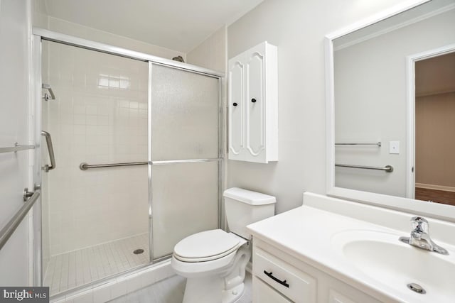 full bath with vanity, a shower stall, and toilet