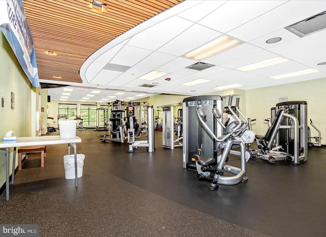 gym with visible vents and a paneled ceiling