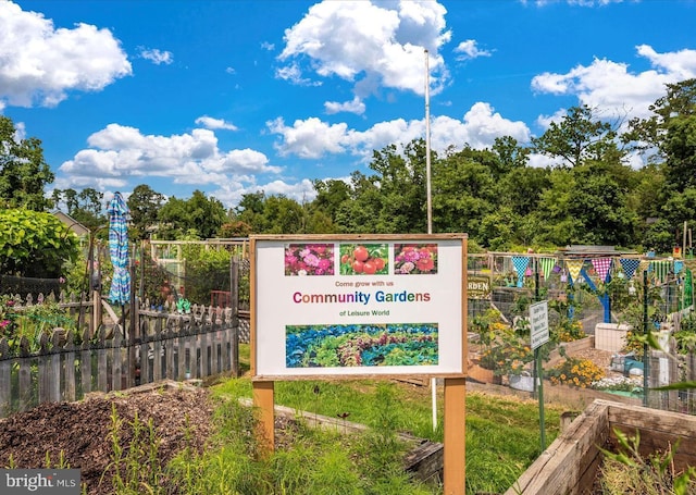 exterior details featuring a vegetable garden and fence