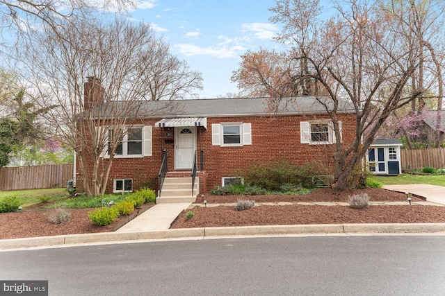 101 S Lexington St, Arlington, VA 22204 - view of front of house featuring brick siding and a chimney