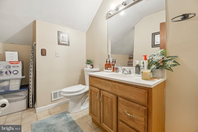 bathroom featuring toilet, visible vents, vanity, vaulted ceiling, and tile patterned floors