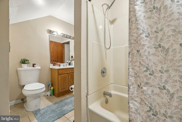 bathroom featuring tile patterned flooring, toilet, vanity, vaulted ceiling, and shower / tub combo with curtain