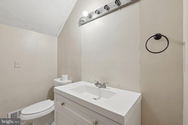 9303 Foxcroft Ave, Clinton, MD 20735 - half bath with toilet, vanity, and vaulted ceiling