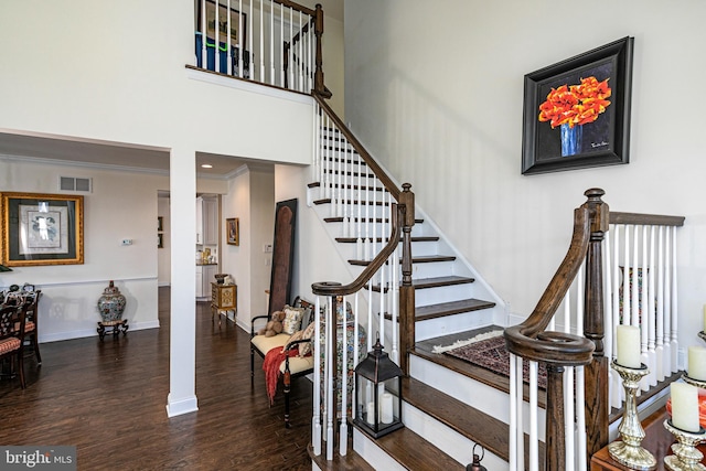 15 Milford Pl, Skillman, NJ 08558 - stairway featuring a high ceiling, wood finished floors, visible vents, baseboards, and crown molding