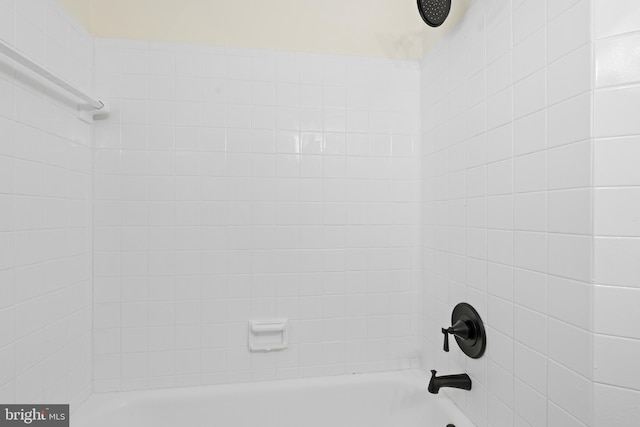 interior details with shower / bath combination