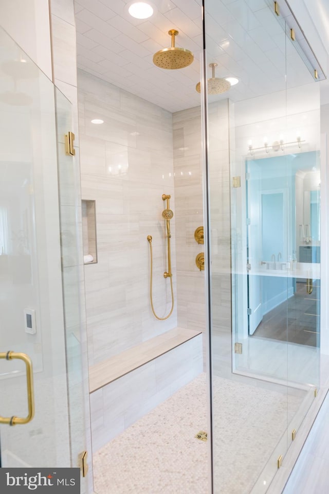 bathroom with a shower stall