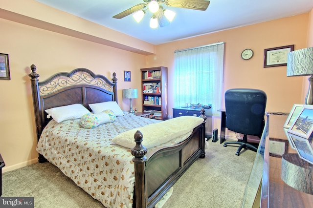 bedroom with baseboards, a ceiling fan, and light colored carpet