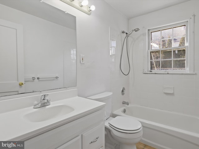 bathroom with toilet, shower / tub combination, and vanity