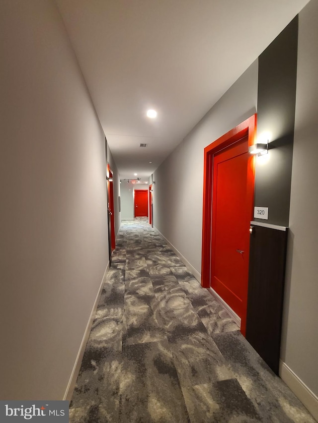 989 S Buchanan St Unit 320, Arlington, VA 22204 - corridor with baseboards and dark carpet