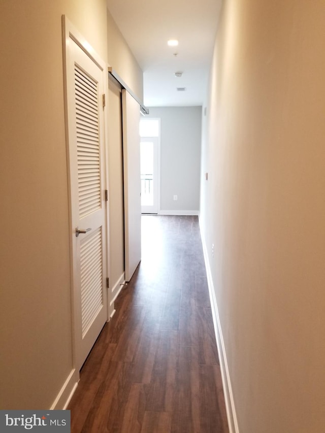 989 S Buchanan St Unit 320, Arlington, VA 22204 - corridor with baseboards and dark wood finished floors