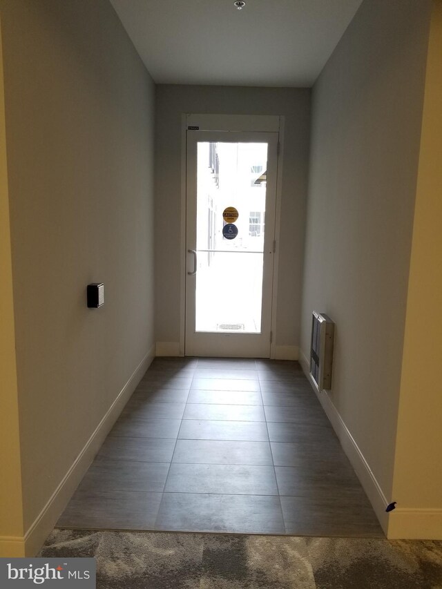 989 S Buchanan St Unit 320, Arlington, VA 22204 - entryway with heating unit, baseboards, and tile patterned floors