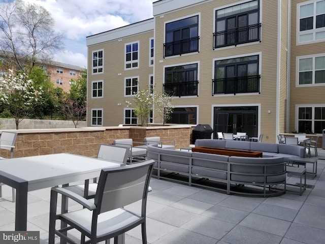 989 S Buchanan St Unit 320, Arlington, VA 22204 - view of patio featuring outdoor lounge area and area for grilling