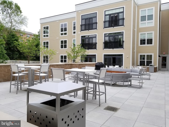 989 S Buchanan St Unit 320, Arlington, VA 22204 - view of patio / terrace featuring outdoor dining area, outdoor lounge area, and area for grilling