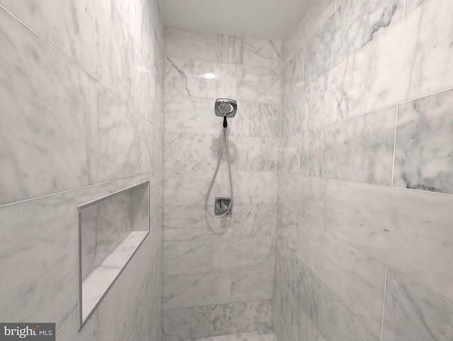 details with a tile shower